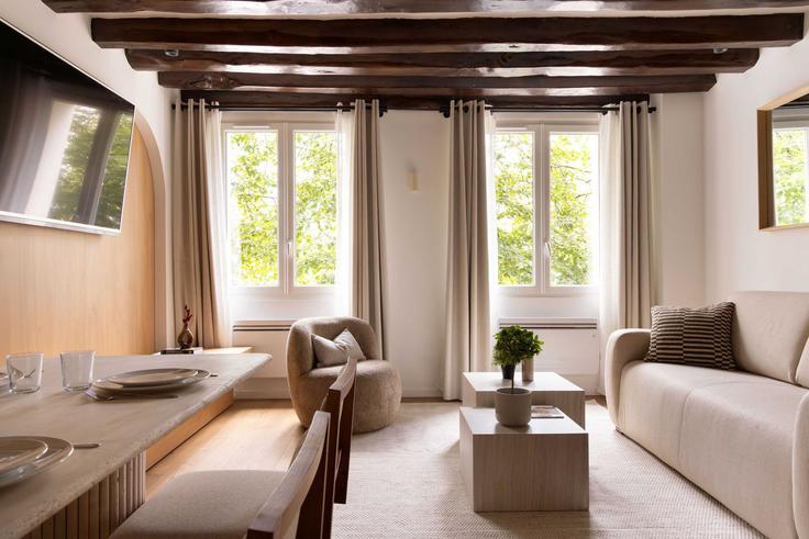 Elegantly designed living room with modern furnishings in an apartment at Building Rue des Innocents - checkmyguest - 1350182 in 1st arrondissement, Paris