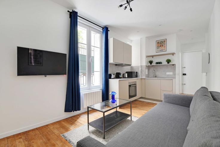 Paris 14th arrondissementのBuilding Avenue Villemain - checkmyguest - 1349453のアパートメントにある、モダンな家具を備えたエレガントなデザインのリビングルーム