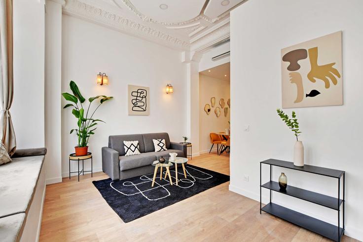 Sala de estar elegantemente projetada com móveis modernos em um apartamento no Building Rue de Dantzig - checkmyguest - 1349925 em 15th arrondissement, Paris