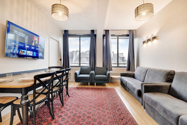 Paris 9th arrondissementのBuilding Rue du Helder - checkmyguest - 1350197のアパートメントにある、モダンな家具を備えたエレガントなデザインのリビングルーム Paris 9th arrondissementのBuilding Rue du Helder - checkmyguest - 1350197のアパートメントにある、モダンな家具を備えたエレガントなデザインのリビングルーム