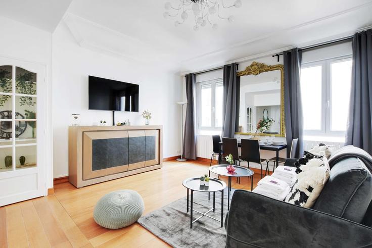 Elegantly designed living room with modern furnishings in an apartment at Building Boulevard de Magenta - checkmyguest - 1350456 in 10th arrondissement, Paris