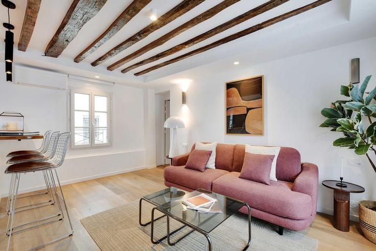 Elegantly designed living room with modern furnishings in an apartment at Building Impasse Jean Beausire - checkmyguest - 1351050 in 3rd arrondissement, Paris