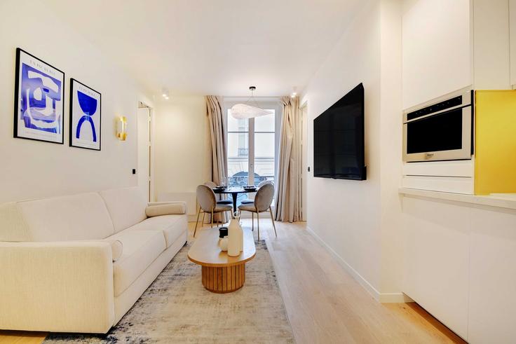 Building Rue de la Grange Batelière - checkmyguest - 1350193 adresindeki bir dairede modern mobilyalarla zarif bir şekilde tasarlanmış oturma odası 9th arrondissement, Paris