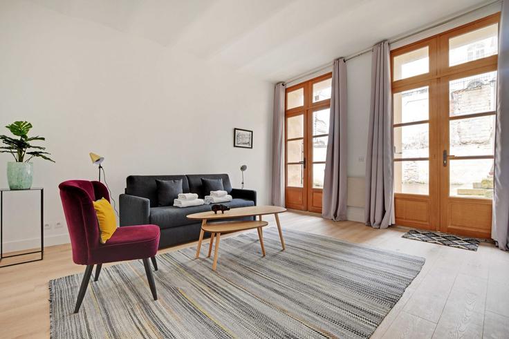 Elegantly designed living room with modern furnishings in an apartment at Building Rue Gît-le-Cœur - checkmyguest - 1348514 in 6th arrondissement, Paris