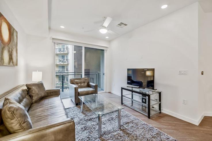 Elegantly designed living room with modern furnishings in an apartment at Building Costa Verde Boulevard - churchillliving - 1343875 in San Diego, San Diego
