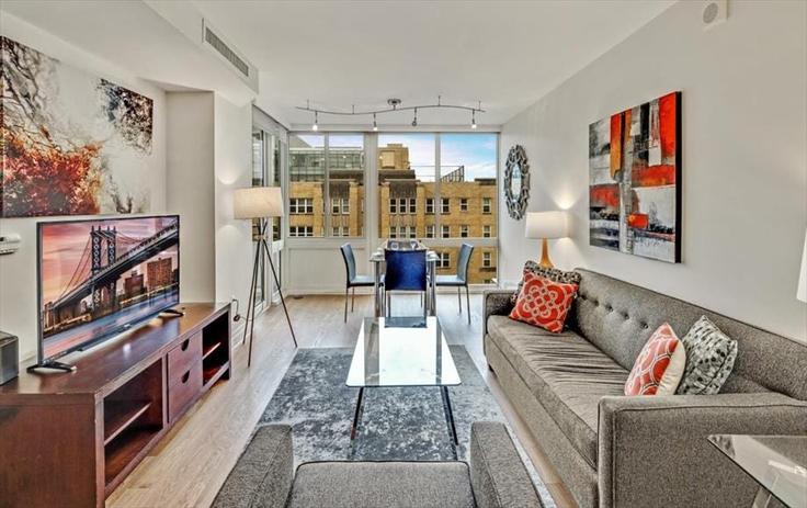 Washington, Washington에 위치한 Building I Street Northwest - churchillliving - 1043382 유닛의 세련된 인테리어가 돋보이는 거실 Washington, Washington에 위치한 Building I Street Northwest - churchillliving - 1043382 유닛의 세련된 인테리어가 돋보이는 거실