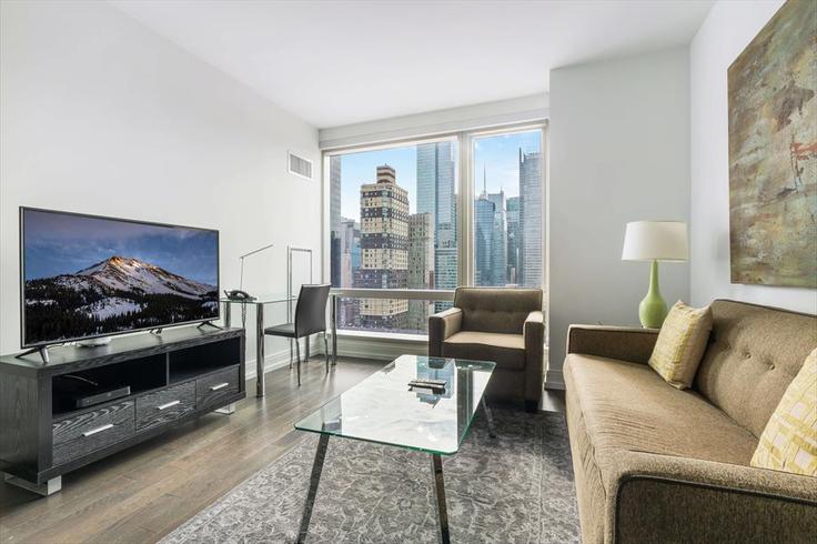 Elegant gestaltetes Wohnzimmer mit moderner Einrichtung in einer Wohnung im Building West 41st Street - churchillliving - 1029861 - NYC in Manhattan, New York Elegant gestaltetes Wohnzimmer mit moderner Einrichtung in einer Wohnung im Building West 41st Street - churchillliving - 1029861 - NYC in Manhattan, New York
