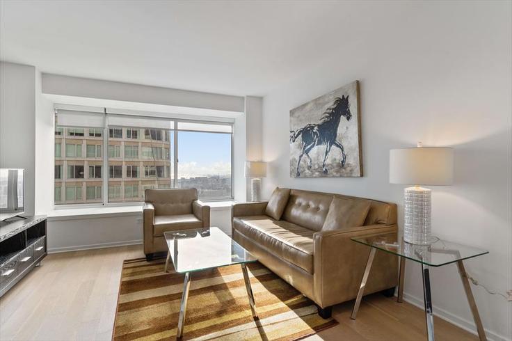 Elegantly designed living room with modern furnishings in an apartment at Building Mission Street - churchillliving - 1039852 - SFO in San Francisco, San Francisco