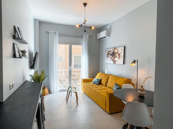 Elegantly designed living room with modern furnishings in an apartment at Building Markou Mpotsari - cielo-homes-greece - 1468526 in Central Athens, Athens