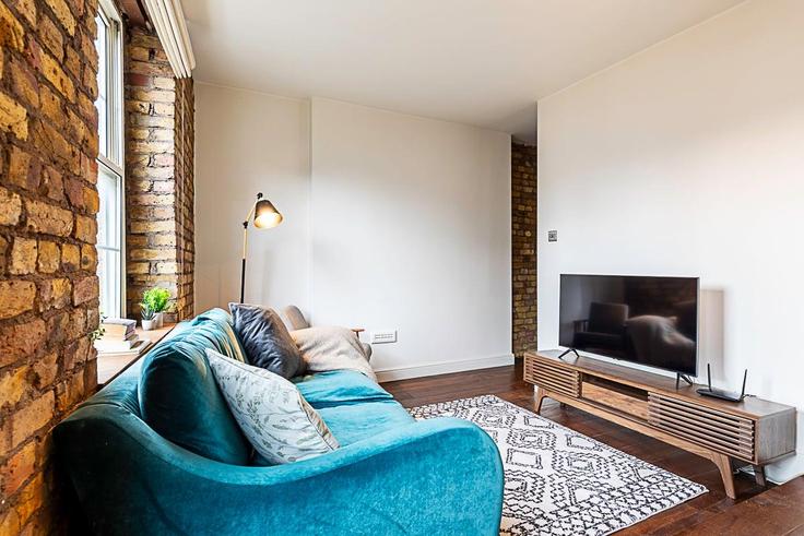 Salle de séjour élégante avec mobilier moderne dans un appartement à Building Wentworth Street - city-relay-rr - 1494876 à London Borough of Tower Hamlets, London