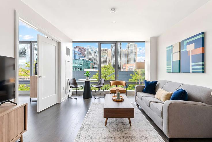 Boston, Boston에 위치한 Building Northern Avenue - compassfurnishedapartments - 1534384 유닛의 세련된 인테리어가 돋보이는 거실 Boston, Boston에 위치한 Building Northern Avenue - compassfurnishedapartments - 1534384 유닛의 세련된 인테리어가 돋보이는 거실