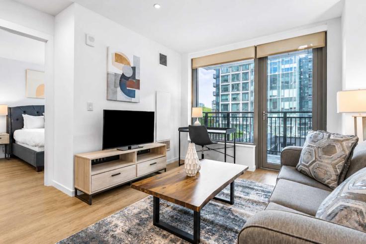 Boston BostonのBuilding Seaport Boulevard - compassfurnishedapartments - 1050352 - BOSのアパートメントにある、モダンな家具を備えたエレガントなデザインのリビングルーム Boston BostonのBuilding Seaport Boulevard - compassfurnishedapartments - 1050352 - BOSのアパートメントにある、モダンな家具を備えたエレガントなデザインのリビングルーム