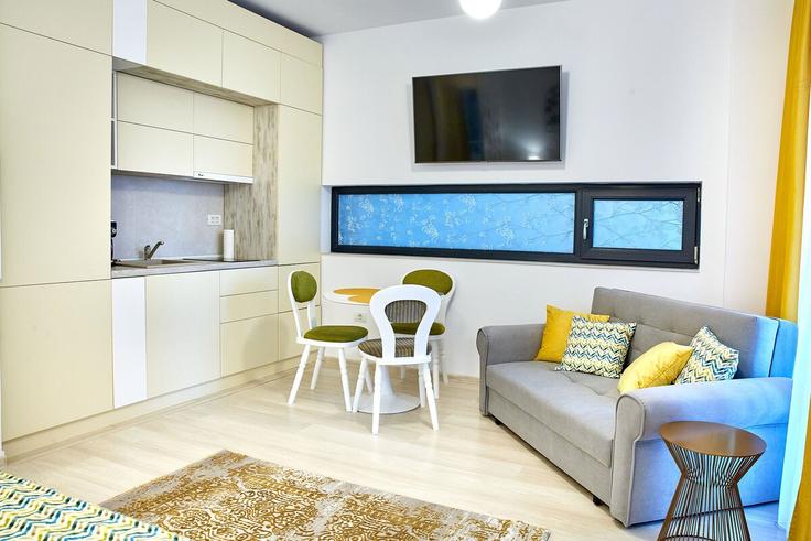 Elegante sala de estar con mobiliario moderno en un apartamento en Building Strada D25 - constantin-mirauta - 1492267 en Mamaia-Sat, Mamaia-Sat Elegante sala de estar con mobiliario moderno en un apartamento en Building Strada D25 - constantin-mirauta - 1492267 en Mamaia-Sat, Mamaia-Sat