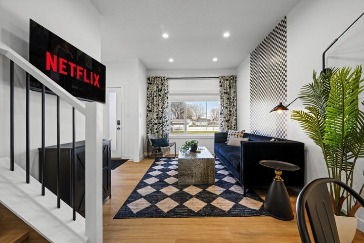 Salle de séjour élégante avec mobilier moderne dans un appartement à Building 155 Street Northwest - contigo-properties - 1308633 - TOR à Edmonton, Edmonton Salle de séjour élégante avec mobilier moderne dans un appartement à Building 155 Street Northwest - contigo-properties - 1308633 - TOR à Edmonton, Edmonton