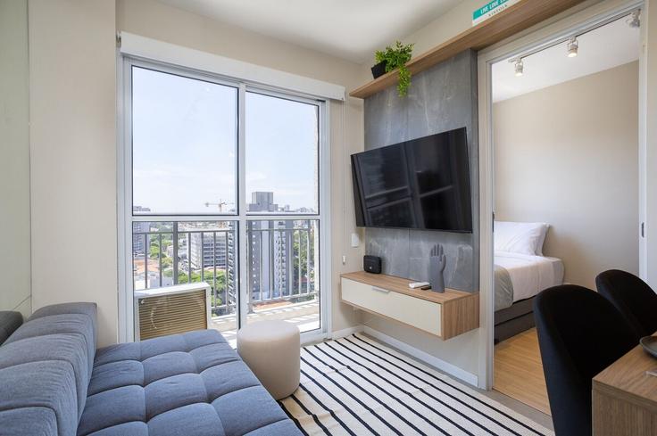 Salle de séjour élégante avec mobilier moderne dans un appartement à Building Avenida dos Bandeirantes - conviva-stay - 1539131 à Indianópolis, São Paulo Salle de séjour élégante avec mobilier moderne dans un appartement à Building Avenida dos Bandeirantes - conviva-stay - 1539131 à Indianópolis, São Paulo