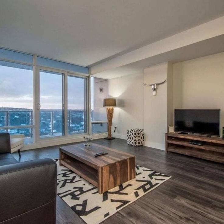 Elegante sala de estar con mobiliario moderno en un apartamento en Building Bedford Highway - corporate-stays - 1222931 - TOR en Rockingham, Halifax Elegante sala de estar con mobiliario moderno en un apartamento en Building Bedford Highway - corporate-stays - 1222931 - TOR en Rockingham, Halifax