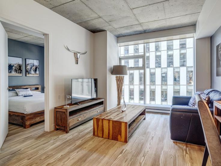 Elegant gestaltetes Wohnzimmer mit moderner Einrichtung in einer Wohnung im Building Rue de Bleury - corporate-stays - 1234589 - TOR in Ville-Marie, Montreal Elegant gestaltetes Wohnzimmer mit moderner Einrichtung in einer Wohnung im Building Rue de Bleury - corporate-stays - 1234589 - TOR in Ville-Marie, Montreal