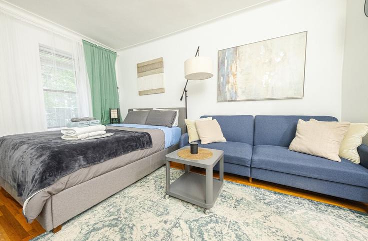 Elegantly designed living room with modern furnishings in an apartment at Building 1st Avenue - coutinhoproperties - 1256855 - NYC in Manhattan, New York