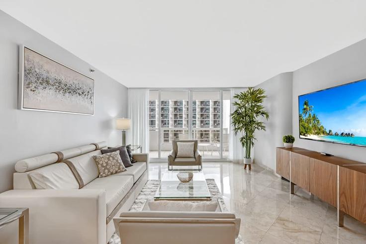 Elegantly designed living room with modern furnishings in an apartment at Building North Bayshore Drive - cozygroup - 1054083 - MIA in Miami, Miami