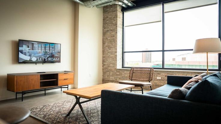 Elegante sala de estar con mobiliario moderno en un apartamento en Building 3rd Avenue South - cozysuites-guesty - 1511913 en Minneapolis, Minneapolis Elegante sala de estar con mobiliario moderno en un apartamento en Building 3rd Avenue South - cozysuites-guesty - 1511913 en Minneapolis, Minneapolis