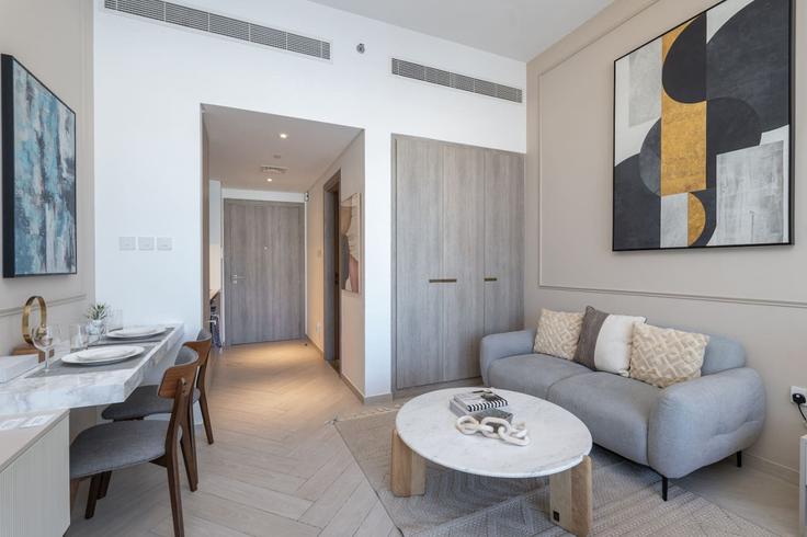 Elegantly designed living room with modern furnishings in an apartment at Building Tariaq Bedon Esm - czechin-holiday-homes - 1505579 in Jumeirah Village, Dubai