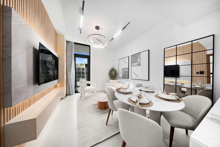 Elegantly designed living room with modern furnishings in an apartment at Building Mu'allaqat Boulevard - daper-holiday-homes-llc - 1397098 in Jumeirah Village, Dubai Elegantly designed living room with modern furnishings in an apartment at Building Mu'allaqat Boulevard - daper-holiday-homes-llc - 1397098 in Jumeirah Village, Dubai