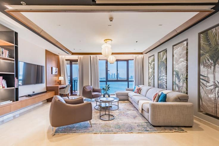 Elegantly designed living room with modern furnishings in an apartment at Building East Crescent - dlx-holiday-homes - 1238913 - DXB in The Palm Jumeirah, Dubai Elegantly designed living room with modern furnishings in an apartment at Building East Crescent - dlx-holiday-homes - 1238913 - DXB in The Palm Jumeirah, Dubai