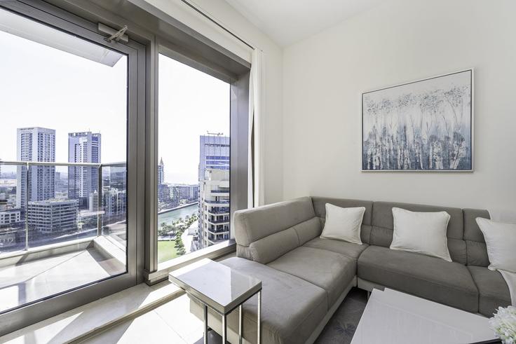 Elegantly designed living room with modern furnishings in an apartment at Building King Salman Bin Abdulaziz Al Saud Street - dlx-holiday-homes - 1239346 - DXB in Dubai Marina, Dubai