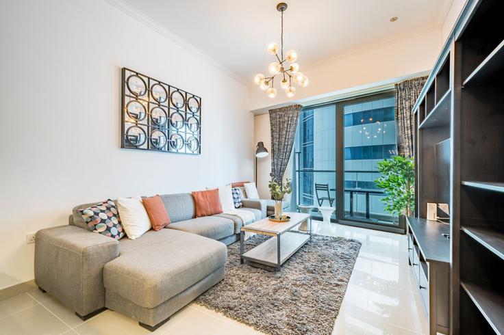 Elegantly designed living room with modern furnishings in an apartment at Building King Salman Bin Abdulaziz Al Saud Street - dlx-holiday-homes - 1239181 - DXB in Dubai Marina, Dubai