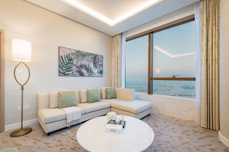 Elegantly designed living room with modern furnishings in an apartment at Building Tariaq Bedon Esm - dlx-holiday-homes - 1239067 - DXB in The Palm Jumeirah, Dubai Elegantly designed living room with modern furnishings in an apartment at Building Tariaq Bedon Esm - dlx-holiday-homes - 1239067 - DXB in The Palm Jumeirah, Dubai