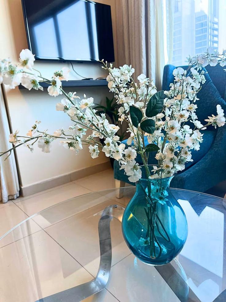 Elegantly designed living room with modern furnishings in an apartment at Building Tariaq Bedon Esm - dream-wild-empire - 1335694 in Downtown Dubai, Dubai Elegantly designed living room with modern furnishings in an apartment at Building Tariaq Bedon Esm - dream-wild-empire - 1335694 in Downtown Dubai, Dubai