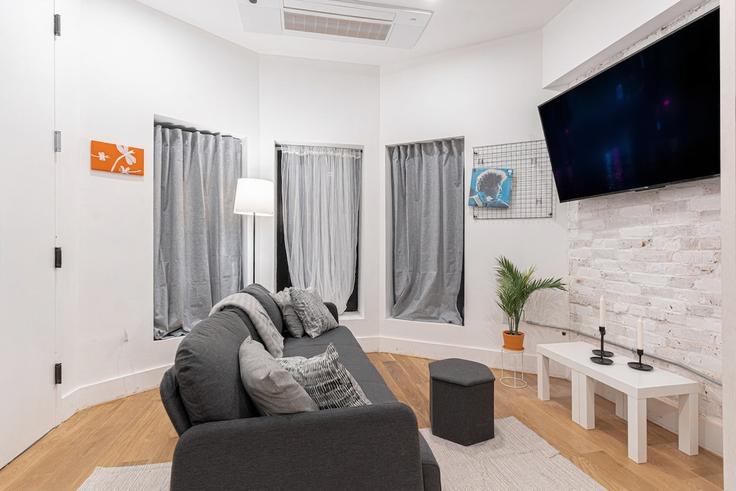 Elegantly designed living room with modern furnishings in an apartment at Building Wilson Avenue - dreamcity-stays - 1515246 in Brooklyn, New York