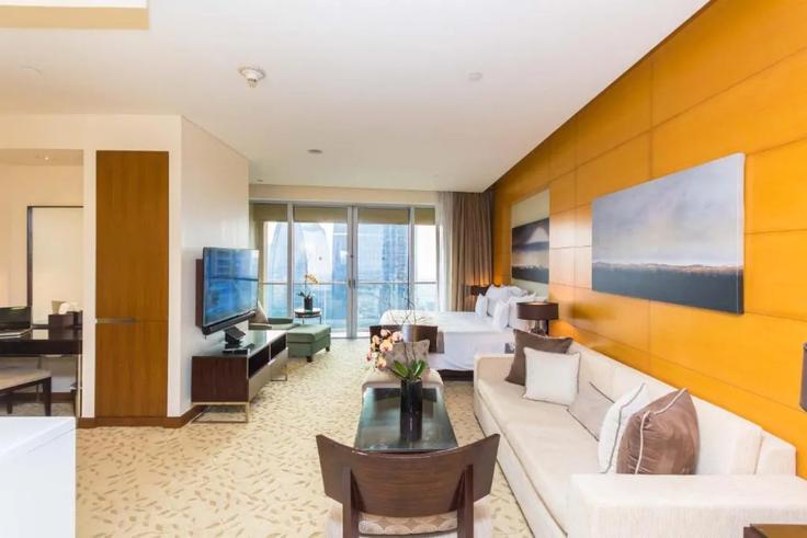 Dubai Burj KhalifaのBuilding Tariaq Bedon Esm - durrani-holiday-homes-llc - 1294937のアパートメントにある、モダンな家具を備えたエレガントなデザインのリビングルーム