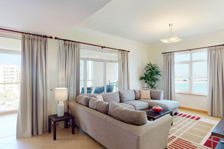 Elegantly designed living room with modern furnishings in an apartment at Building Palm Jumeirah Rd - dvh-holiday-homes-llc - 1312079 - DXB in The Palm Jumeirah, Dubai Elegantly designed living room with modern furnishings in an apartment at Building Palm Jumeirah Rd - dvh-holiday-homes-llc - 1312079 - DXB in The Palm Jumeirah, Dubai