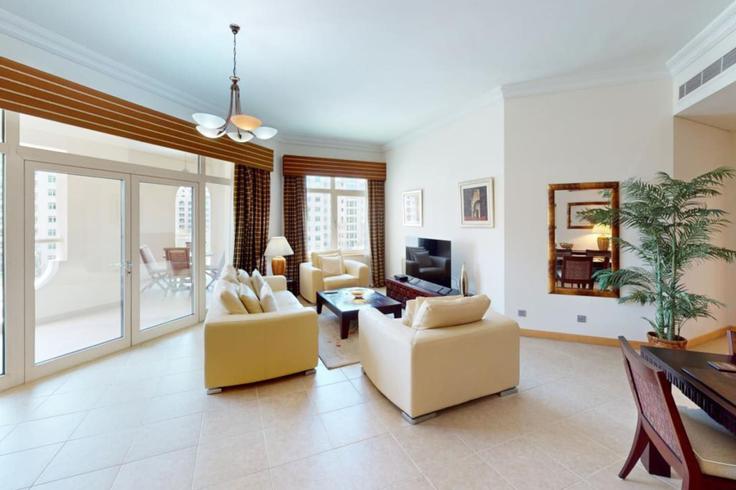 Elegantly designed living room with modern furnishings in an apartment at Building Palm Jumeirah Rd - dvh-holiday-homes-llc - 1312081 - DXB in The Palm Jumeirah, Dubai Elegantly designed living room with modern furnishings in an apartment at Building Palm Jumeirah Rd - dvh-holiday-homes-llc - 1312081 - DXB in The Palm Jumeirah, Dubai