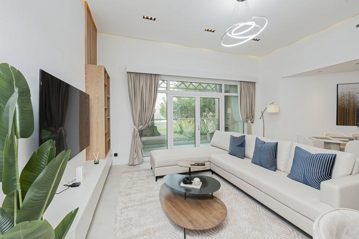 Elegantly designed living room with modern furnishings in an apartment at Building Palm Jumeirah Rd - dvh-holiday-homes-llc - 1312086 - DXB in The Palm Jumeirah, Dubai Elegantly designed living room with modern furnishings in an apartment at Building Palm Jumeirah Rd - dvh-holiday-homes-llc - 1312086 - DXB in The Palm Jumeirah, Dubai