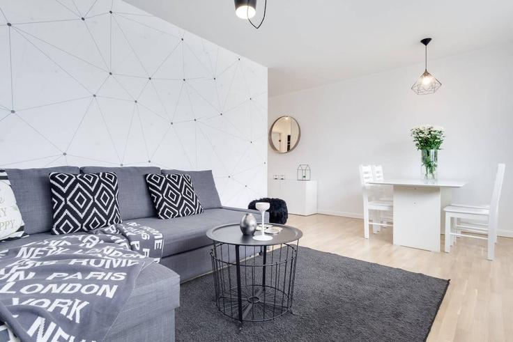 Gdańsk GdańskのBuilding aleja Jana Pawła II - elite-apartments - 1319984のアパートメントにある、モダンな家具を備えたエレガントなデザインのリビングルーム Gdańsk GdańskのBuilding aleja Jana Pawła II - elite-apartments - 1319984のアパートメントにある、モダンな家具を備えたエレガントなデザインのリビングルーム