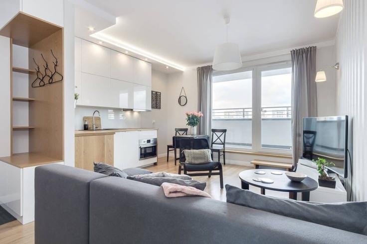 Salle de séjour élégante avec mobilier moderne dans un appartement à Building Powstańców Wielkopolskich - elite-apartments - 1319988 à Gdańsk, Gdańsk Salle de séjour élégante avec mobilier moderne dans un appartement à Building Powstańców Wielkopolskich - elite-apartments - 1319988 à Gdańsk, Gdańsk