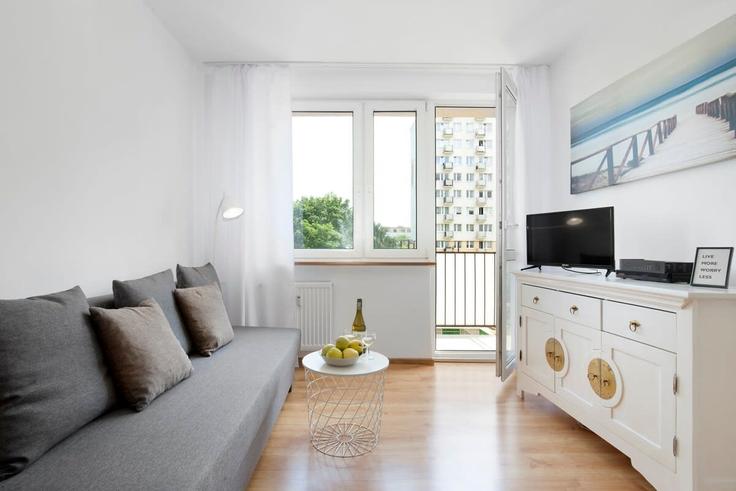 Sala de estar elegantemente projetada com móveis modernos em um apartamento no Building Gospody - elite-apartments - 1319997 em Gdańsk, Gdańsk Sala de estar elegantemente projetada com móveis modernos em um apartamento no Building Gospody - elite-apartments - 1319997 em Gdańsk, Gdańsk
