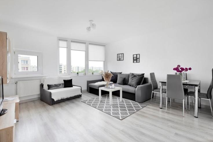 Gdańsk GdańskのBuilding Generała T. Bora-Komorowskiego - elite-apartments - 1320178のアパートメントにある、モダンな家具を備えたエレガントなデザインのリビングルーム Gdańsk GdańskのBuilding Generała T. Bora-Komorowskiego - elite-apartments - 1320178のアパートメントにある、モダンな家具を備えたエレガントなデザインのリビングルーム