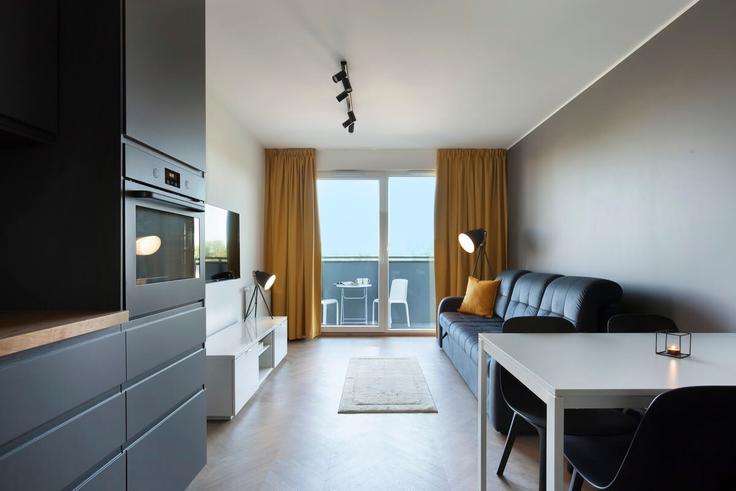 Gdańsk, Gdańsk에 위치한 Building Letnicka - elite-apartments - 1320019 아파트의 세련된 인테리어가 돋보이는 거실 Gdańsk, Gdańsk에 위치한 Building Letnicka - elite-apartments - 1320019 아파트의 세련된 인테리어가 돋보이는 거실