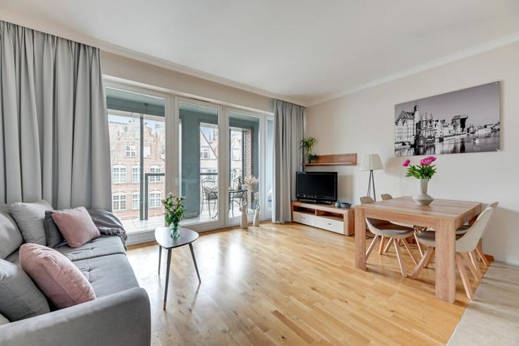 Salle de séjour élégante avec mobilier moderne dans un appartement à Building Tandeta - elite-apartments - 1340983 à Gdańsk, Gdańsk Salle de séjour élégante avec mobilier moderne dans un appartement à Building Tandeta - elite-apartments - 1340983 à Gdańsk, Gdańsk