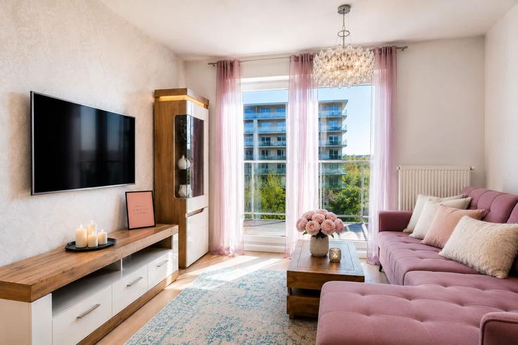 Elegante sala de estar con mobiliario moderno en un apartamento en Building Obrońców Wybrzeża - elite-apartments - 1319990 en Gdańsk, Gdańsk