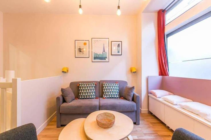 Salle de séjour élégante avec mobilier moderne dans un appartement à Building Rue Lamblardie - evengestion - 1044829 - PAR à 12th arrondissement, Paris Salle de séjour élégante avec mobilier moderne dans un appartement à Building Rue Lamblardie - evengestion - 1044829 - PAR à 12th arrondissement, Paris