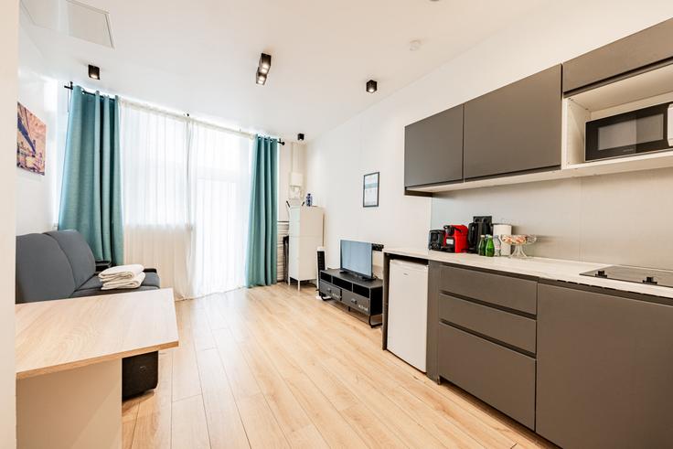 Salle de séjour élégante avec mobilier moderne dans un appartement à Building Rue de Mouzaïa - evengestion - 1044833 - PAR à 19th arrondissement, Paris Salle de séjour élégante avec mobilier moderne dans un appartement à Building Rue de Mouzaïa - evengestion - 1044833 - PAR à 19th arrondissement, Paris