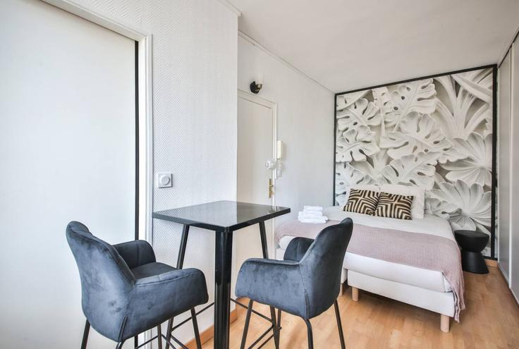 Dining table with stylish chairs in an apartment at Building Rue Jean Daudin - evengestion - 1044840 - PAR in 15th arrondissement, Paris