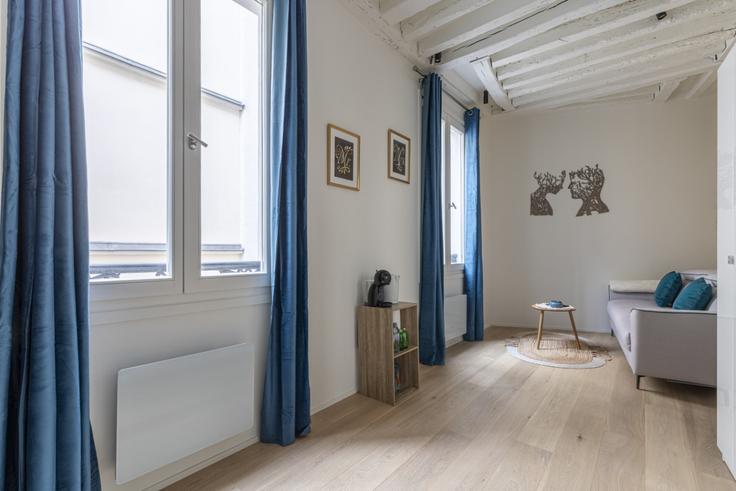 Elegantly designed living room with modern furnishings in an apartment at Building Rue Saint-André des Arts - evengestion - 1048832 - PAR in 6th arrondissement, Paris