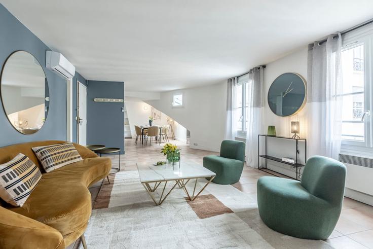 Sala de estar elegantemente projetada com móveis modernos em um apartamento no Building Rue Saint-Marc - evengestion - 1062662 - PAR em 2nd arrondissement, Paris Sala de estar elegantemente projetada com móveis modernos em um apartamento no Building Rue Saint-Marc - evengestion - 1062662 - PAR em 2nd arrondissement, Paris