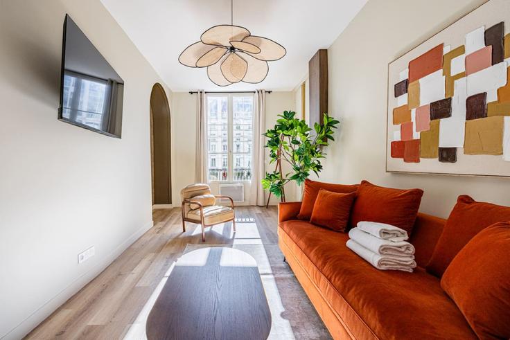 Sala de estar elegantemente projetada com móveis modernos em um apartamento no Building Rue Saint-Marc - evengestion - 1321792 em 2nd arrondissement, Paris Sala de estar elegantemente projetada com móveis modernos em um apartamento no Building Rue Saint-Marc - evengestion - 1321792 em 2nd arrondissement, Paris