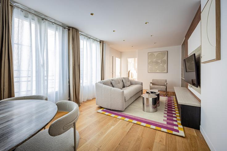 Elegantly designed living room with modern furnishings in an apartment at Building Rue de l'Ancienne Comédie - evengestion - 1381703 in 6th arrondissement, Paris